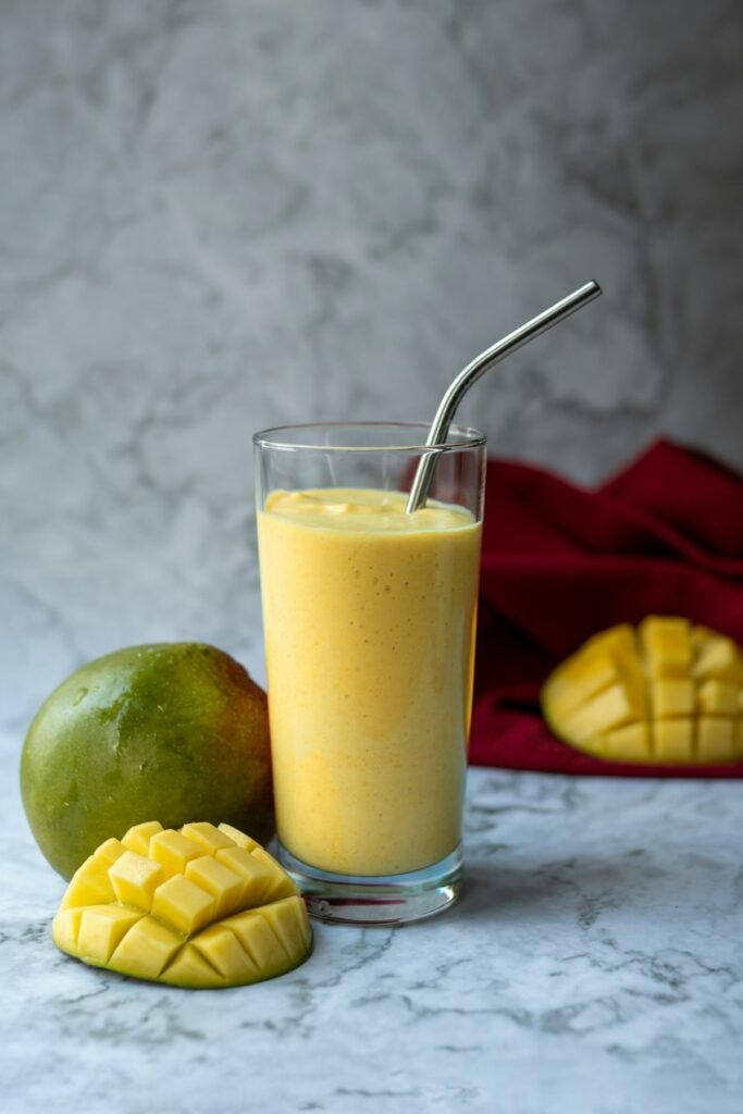 Mango lassi mocktail in a tall glass